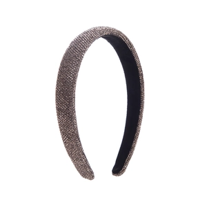 Macro detail of high-top headband featuring grey rhinestones and velvet lining