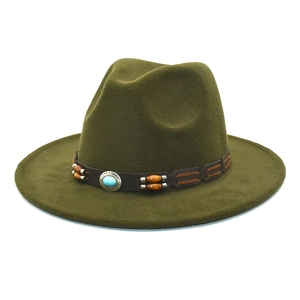 Detail of olive green wool fedora hat featuring a brown leather band with turquoise bead