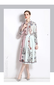 Close-up of pleated dress detailing floral geometric prints and elegant lapel collar