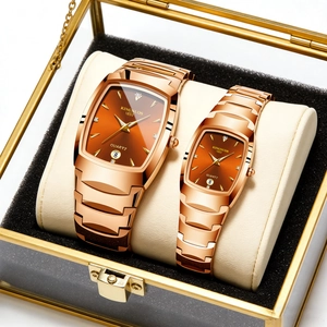 Close-up of gold quartz watches for couples in a luxury gift box with calendar feature