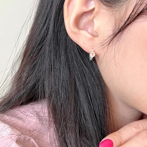925 sterling silver hoop earrings with strawberry quartz stone worn on a female ear