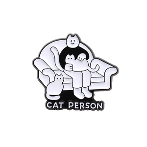 Cute black and white cat person enamel pin with CAT PERSON text for backpacks