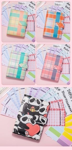 Detail view of A6 French budget planner binder with colorful plaid and panda patterns