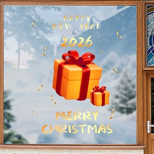 Golden Christmas gift box stickers with Happy New Year 2026 text on glass window