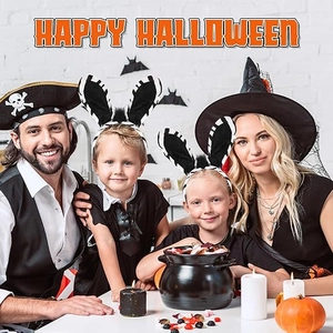 Family wearing leopard cat ears and witch hats for a happy Halloween costume party
