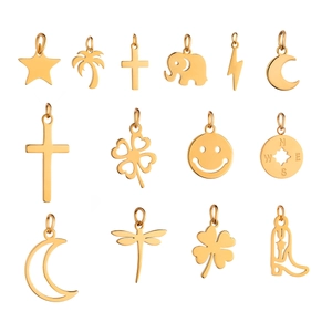 Detailed assortment of 12 gold stainless steel charms including star and clover shapes