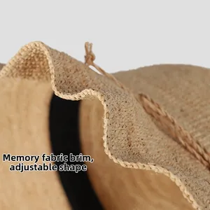 Detail of raffia straw hat showing shapeable memory wire brim for flexible styling