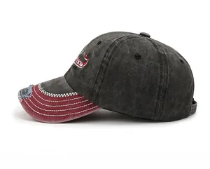 Detail view of washed vintage baseball cap with distressed brim and vintage embroidery