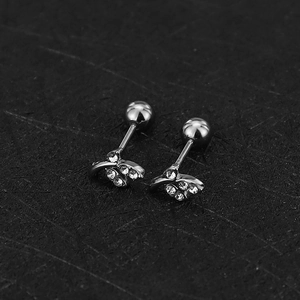 Detail view of silver threaded stud earrings with cherry design and sparkling zircons