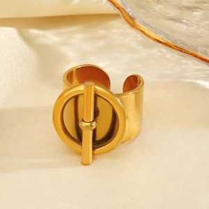 Golden wide open ring with geometric OT buckle design on elegant silk background