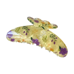 Fresh butterfly hair claw clip in pale yellow resin with colorful floral pattern design