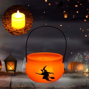 Detail of Halloween witch bucket with silhouette design and LED tea light candle
