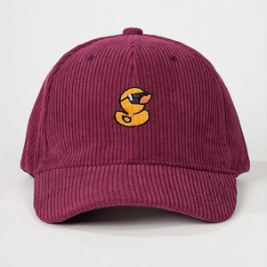 Detailed close-up of burgundy corduroy baseball cap with yellow duck embroidery
