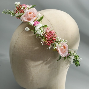 Detailed view of handmade pink rose floral headband for bridal accessories