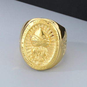 Macro detail of gold-plated 18k signet ring featuring the Sacred Heart of Jesus engraving