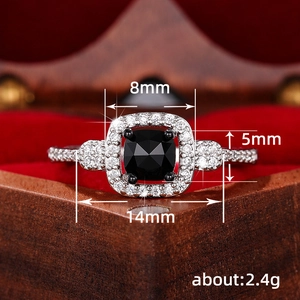 Classic halo ring with black cushion-cut gemstone and crystal micro-pave detailing
