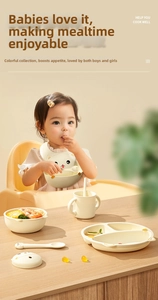 Cozy lifestyle scene showing five-piece silicone baby feeding set on a wooden table