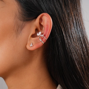 Detail view of silver zircon double-layer ear cuff and butterfly stud earring set