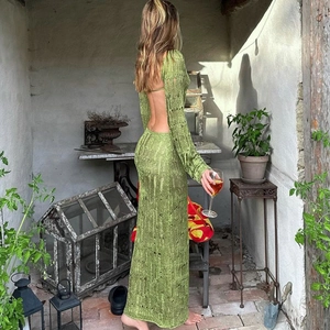 Detail view of backless cut-out knitted maxi dress with hollow texture and long sleeves