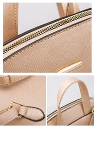 Detail view of champagne gold Saffiano leather backpack with metallic zipper and handle