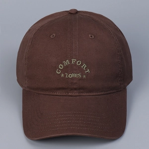 Close-up of cotton baseball cap with COMFORT ZONES olive green embroidery detail
