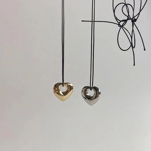Hollow heart pendant necklaces in gold and silver finish with black cord chain