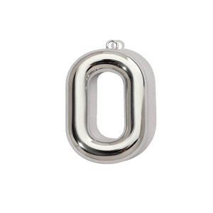 Macro view of polished silver stainless steel letter O pendant with reflective finish