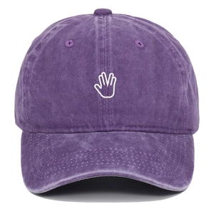 Close-up of vintage washed purple cotton baseball cap with white palm embroidery detail