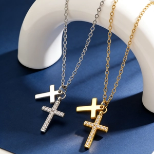 Double cross pendant necklace in gold and silver with sparkling cubic zirconia stones