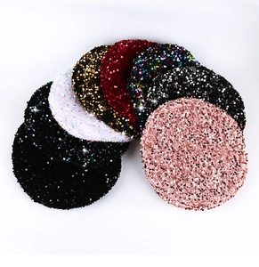 Detail showing various colors of sparkling sequin fabrics for vintage beret hats