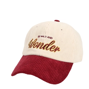 Corduroy baseball cap with Be Wild embroidery in cream and burgundy color block style