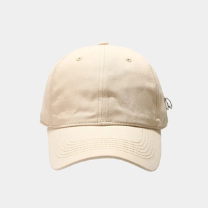 Beige street style baseball cap with silver metal rings on brim minimalist design