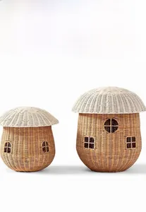 Detail of two nordic style woven mushroom storage baskets with cute window designs