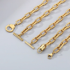 Detail of 10mm golden industrial chain with various OT buckles and lobster clasps