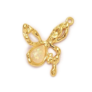 Detail of a golden butterfly pendant featuring a central iridescent opal stone inlay