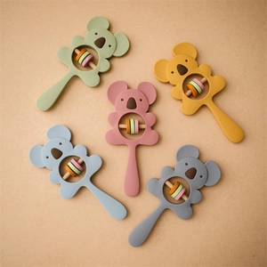 Five silicone koala baby rattles with wooden rings in various soft morandi colors