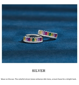 Close-up of 925 silver hoop earrings with vibrant colorful rectangular zircon stones