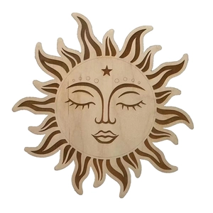 Detail view of a hand-carved wooden sun wall art with radiant rays and intricate facial features
