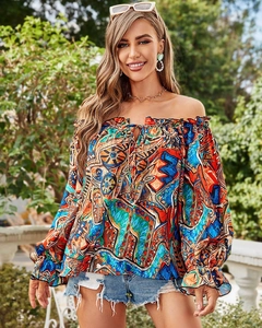 Detail of off-shoulder bohemian print top with ruffle sleeves and drawstring neck
