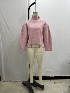 Detail of pink fleece texture on a loose fit high-collar sweatshirt for women