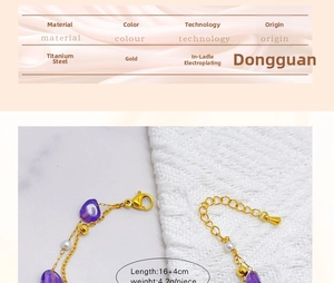 Detail of adjustable gold-plated stainless steel chain with purple beads and lobster clasp