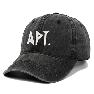 Washed black denim baseball cap with white embroidered APT letters and curved brim