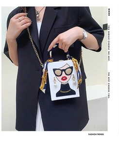 White box evening bag with cartoon character print and silk scarf handle detail