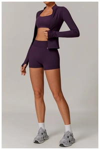 Three-piece dark purple seamless yoga set with zipper jacket and high waist shorts