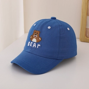Detailed view of blue cotton baseball cap featuring brown bear embroidery and BEAR text