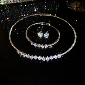 Detail of silver pearl and rhinestone jewelry set including necklace, bracelet and earrings
