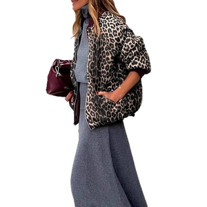 Detail of leopard print bomber jacket featuring ribbed cuffs and a metallic front zipper