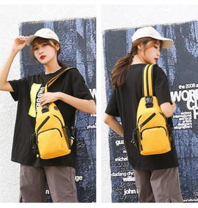 Front and back views of a bright yellow oxford cloth chest bag worn by a model