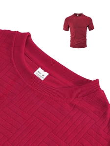 Macro detail of wine red polo shirt fabric texture with waffle knit and care label