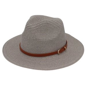 Close-up of gray Panama hat texture with brown faux leather band and gold buckle